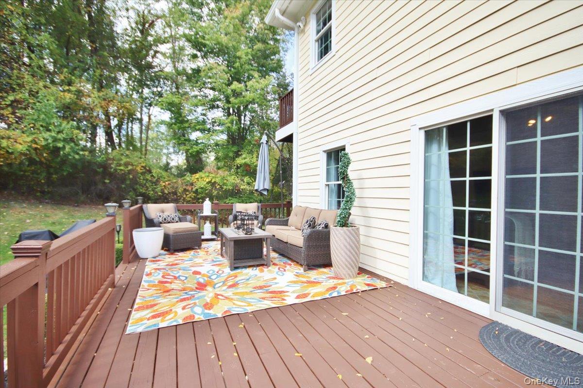 430 Eder Road Stormville, NY 12582 - Photo 18 of 50 a view of a deck with couches and wooden floor