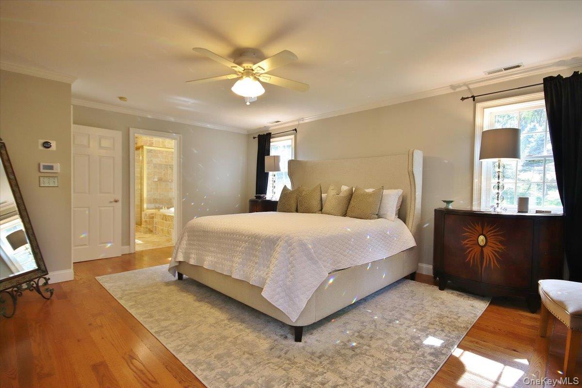 430 Eder Road Stormville, NY 12582 - Photo 27 of 50 a bedroom with a bed and a chandelier