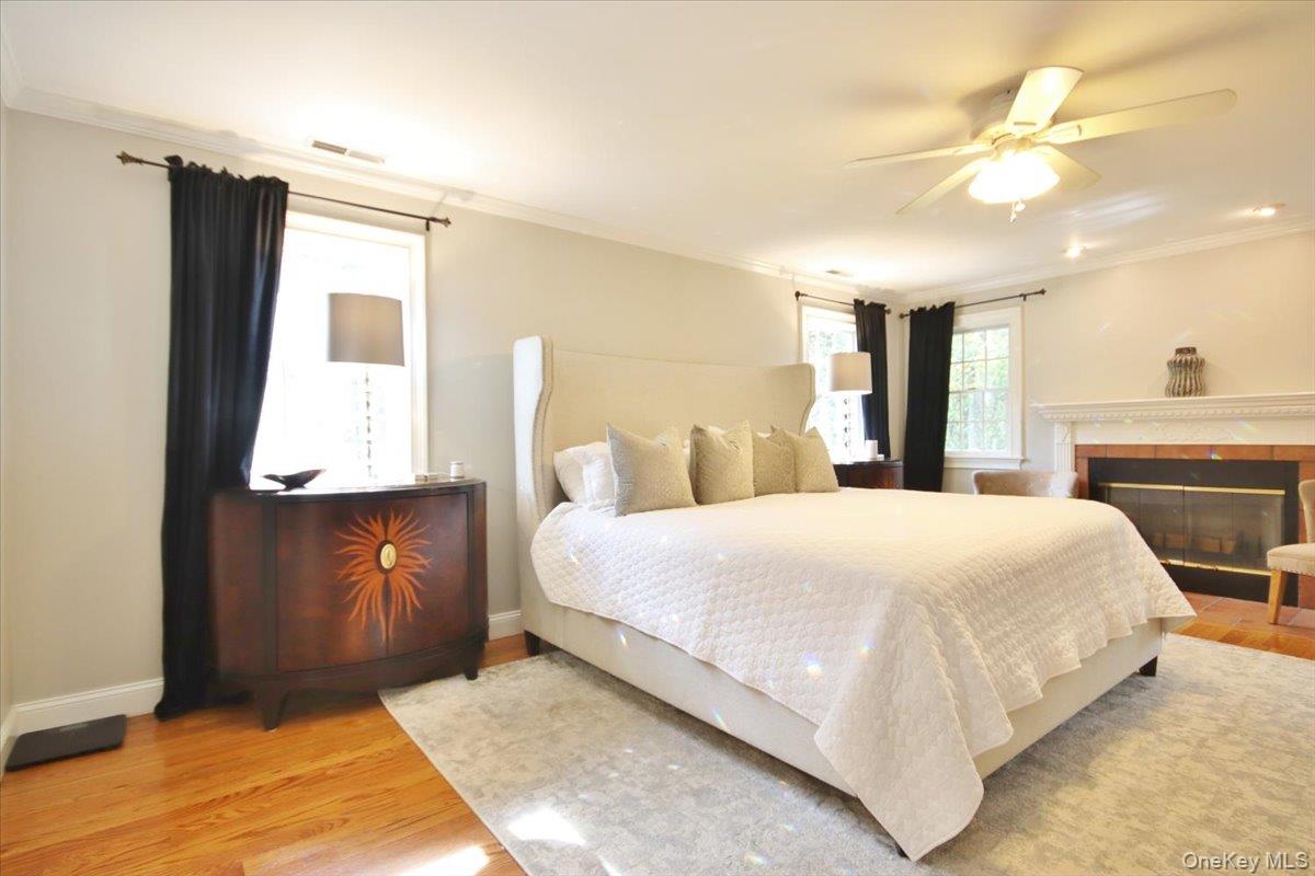 430 Eder Road Stormville, NY 12582 - Photo 30 of 50 a bedroom with a large bed and a chandelier