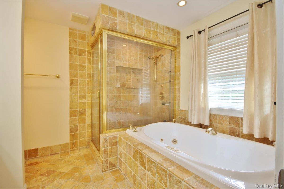 430 Eder Road Stormville, NY 12582 - Photo 31 of 50 a bathroom with a tub a sink and a shower