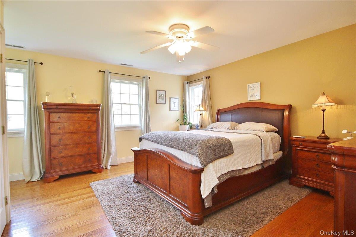 430 Eder Road Stormville, NY 12582 - Photo 40 of 50 a bedroom with a bed and wooden floor