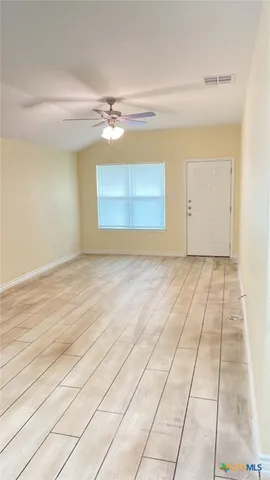 a view of a room with an empty space