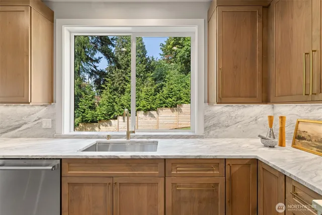 a kitchen with a sink and a window