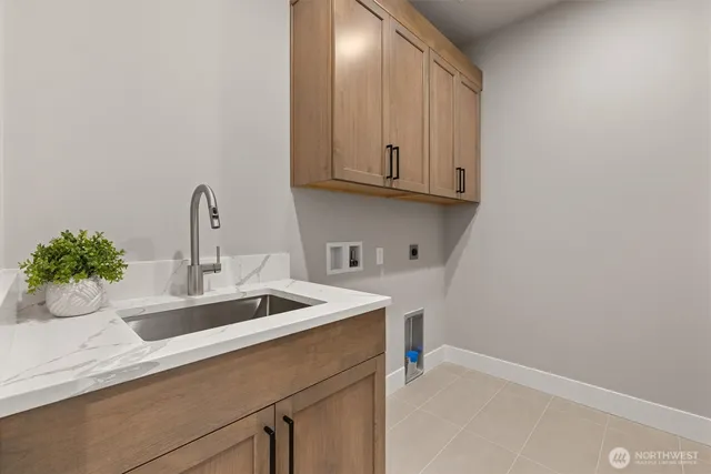a kitchen with a sink and cabinets
