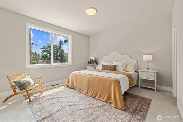 a bedroom with bed and window