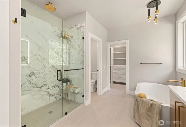 a bathroom with a bathtub and shower