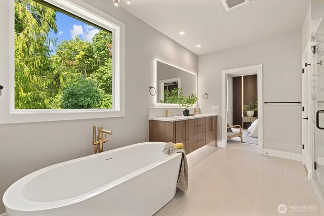 a bathroom with a bathtub and a sink