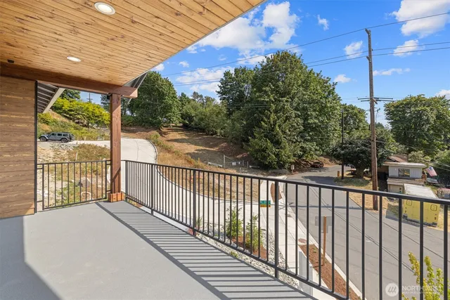 a balcony with trees in front of it