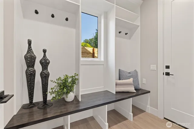 a table with a vase and flowers on it