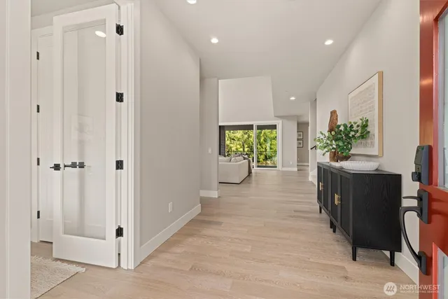 a view of hallway with wooden floor