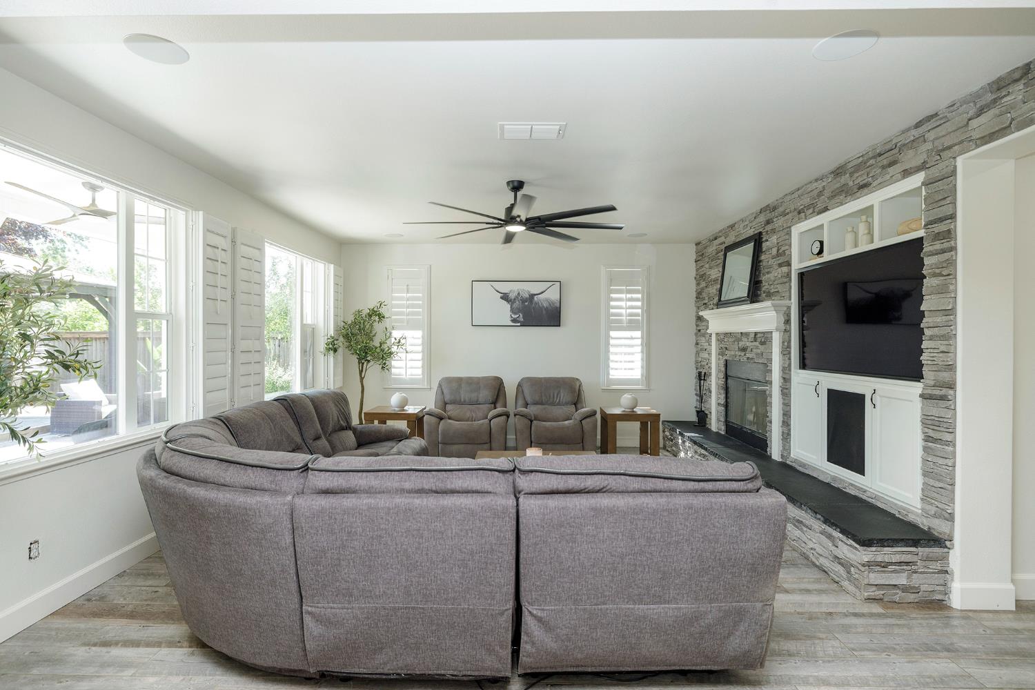 1682 Fairway Oaks Court Ripon, CA 95366 - Photo 11 of 51 a living room with fireplace furniture and a flat screen tv