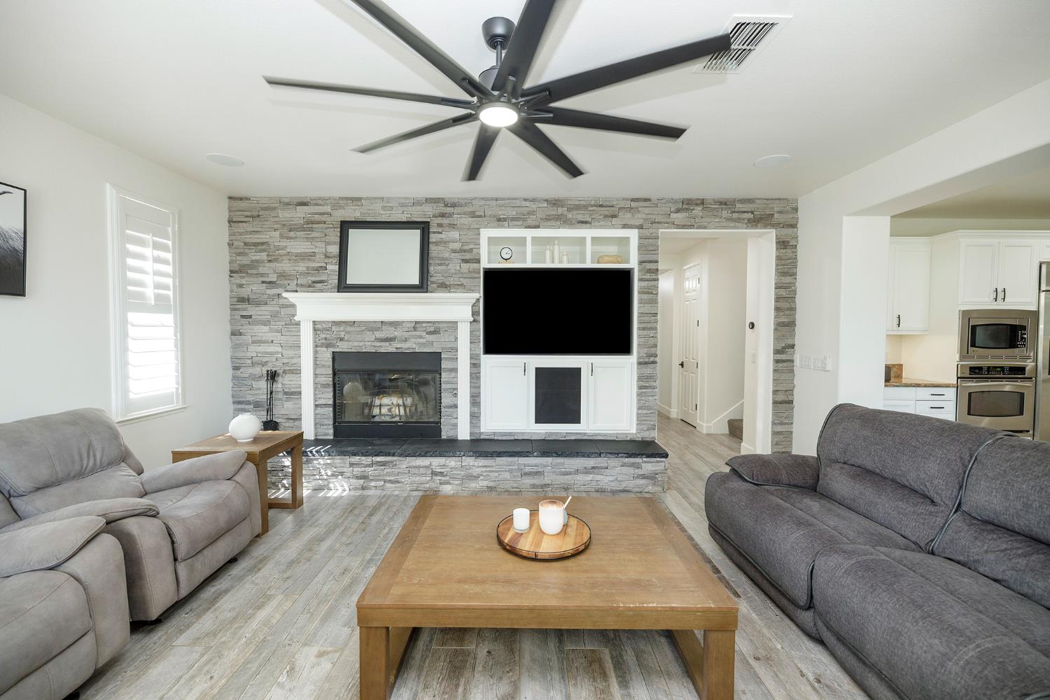 1682 Fairway Oaks Court Ripon, CA 95366 - Photo 13 of 51 a living room with furniture and a fireplace