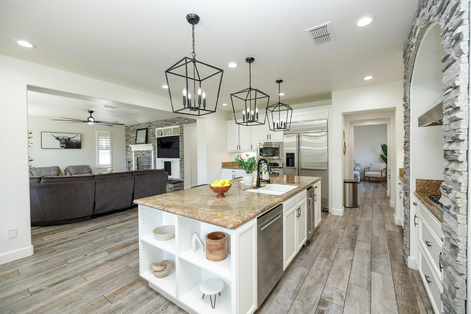 1682 Fairway Oaks Court Ripon, CA 95366 - Photo 20 of 51 a kitchen with stainless steel appliances granite countertop a sink stove and refrigerator