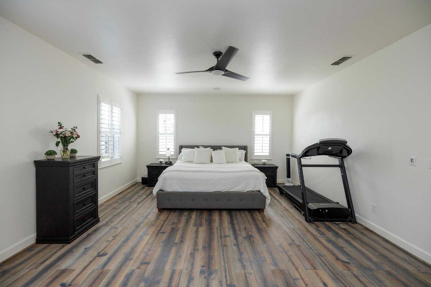 1682 Fairway Oaks Court Ripon, CA 95366 - Photo 25 of 51 a bedroom with a bed and wooden floor
