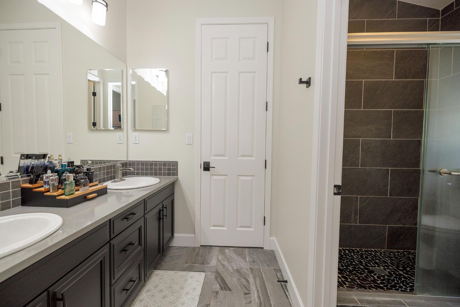 1682 Fairway Oaks Court Ripon, CA 95366 - Photo 33 of 51 a view of a bathroom with a sink and a mirror