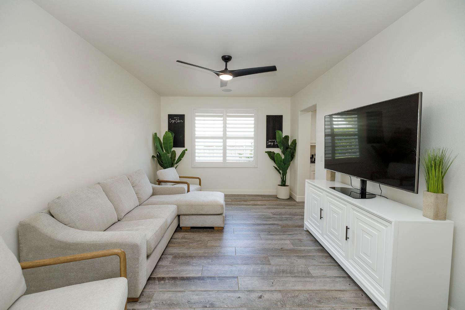 1682 Fairway Oaks Court Ripon, CA 95366 - Photo 7 of 51 a living room with furniture and a flat screen tv