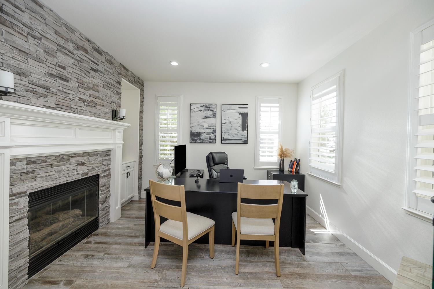1682 Fairway Oaks Court Ripon, CA 95366 - Photo 10 of 51 a dining room with furniture a fireplace and wooden floor