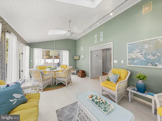 a room with furniture and a flat screen tv