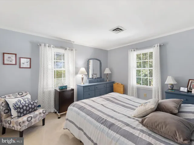 a bedroom with a bed and a lamp