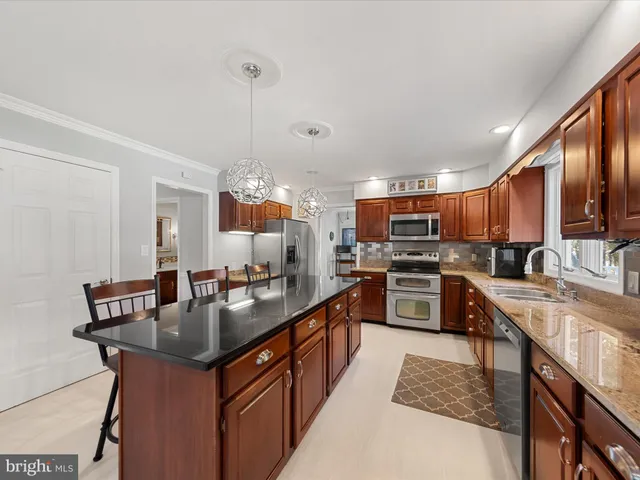 a kitchen with a table and chairs in it