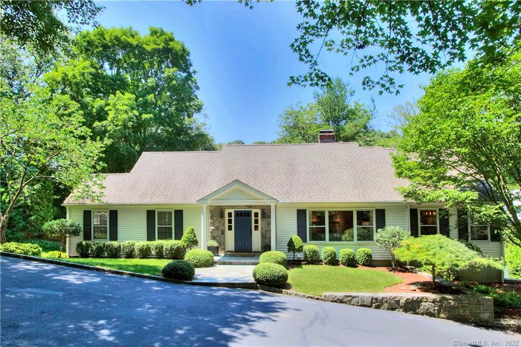 46 Hillspoint Road Westport, CT 06880 - Photo 1 of 1 a front view of a house with garden