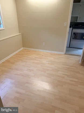 a view of a refrigerator in a kitchen