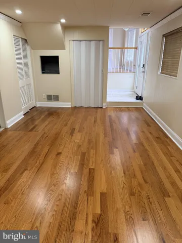 a view of entryway with wooden floor