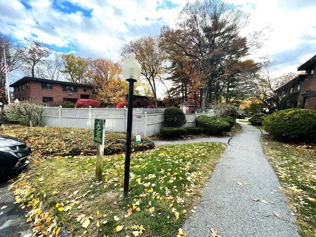 a view of a street with houses on both side