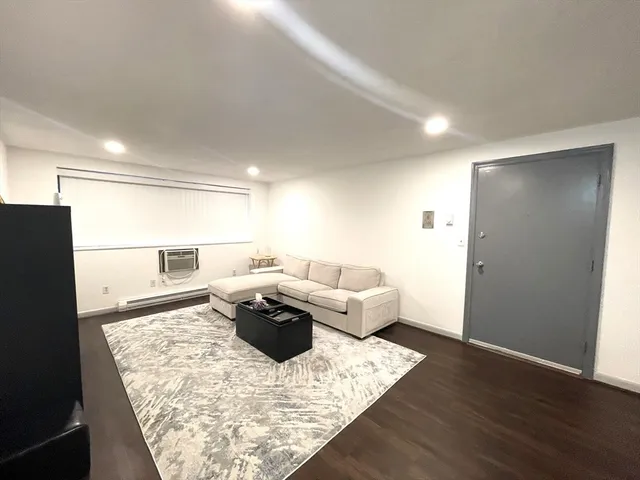 a living room with furniture and a table