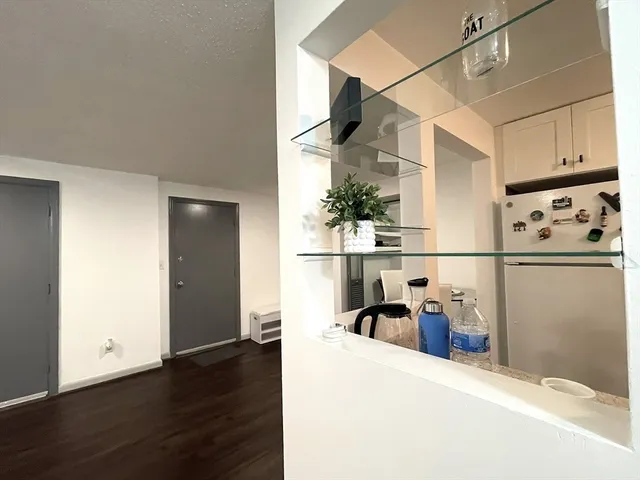 a view of a storage & utility room with wooden floor