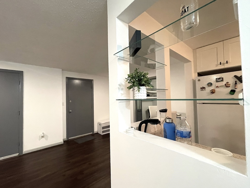 1325 Worcester Road, Unit C3 Framingham, MA 01701 - Photo 8 of 27 a view of a storage & utility room with wooden floor