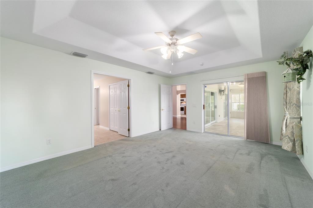 16369 Southwest 14th Avenue Road Ocala, FL 34473 - Photo 25 of 49 a view of an empty room with chandelier fan