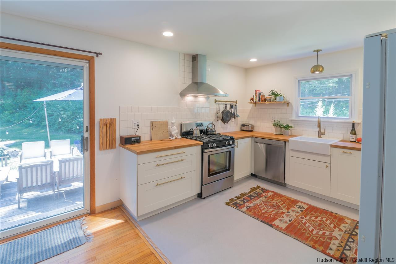 40 Meyers Road Kingston, NY 12401 - Photo 11 of 26 a kitchen with a sink stove and wooden cabinets