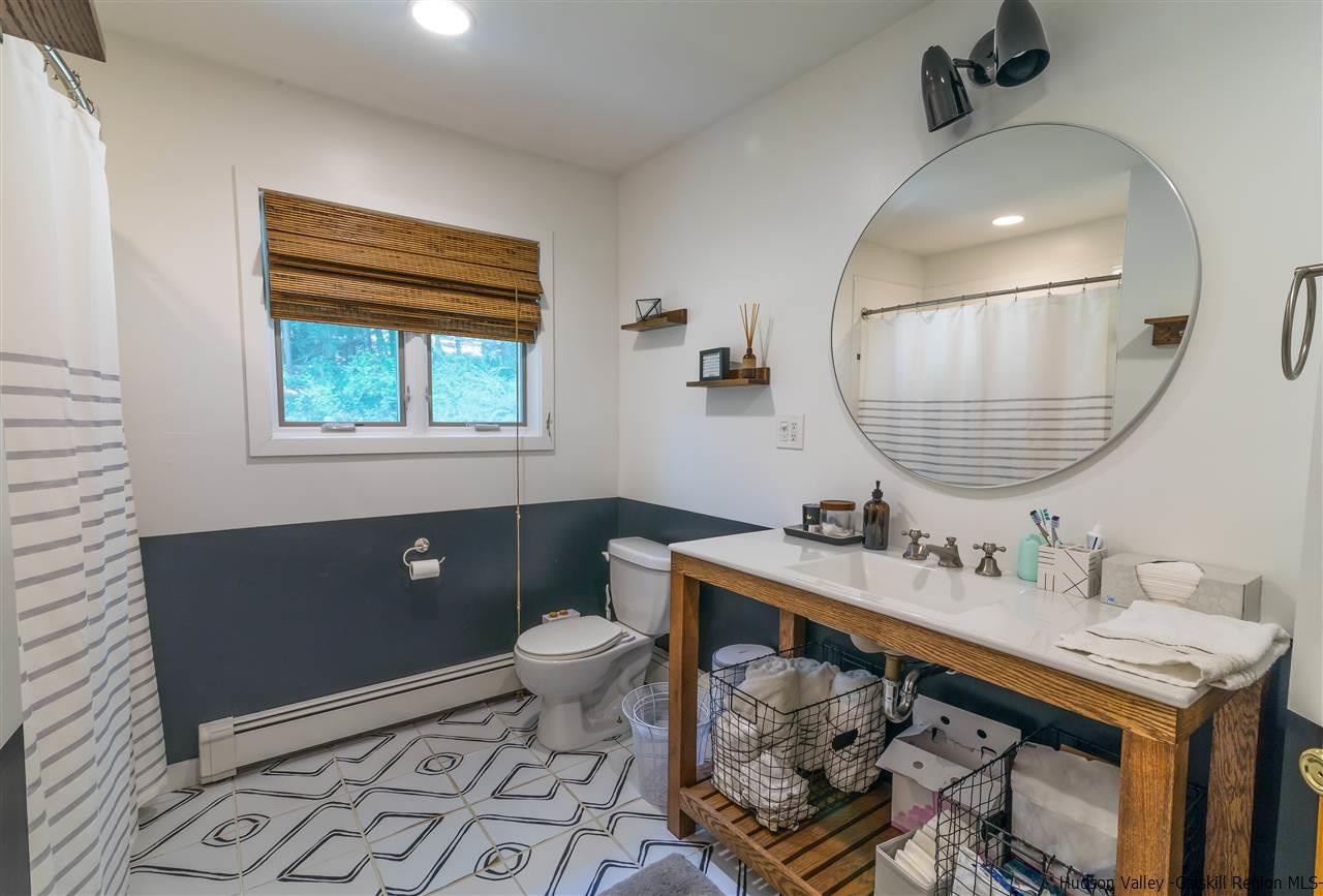40 Meyers Road Kingston, NY 12401 - Photo 13 of 26 a bathroom with a sink toilet a mirror and vanity