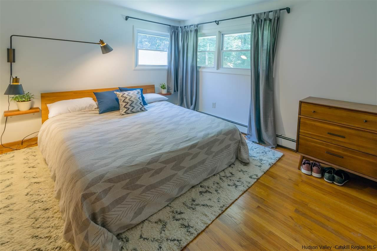 40 Meyers Road Kingston, NY 12401 - Photo 14 of 26 a bedroom with a bed and wooden floor