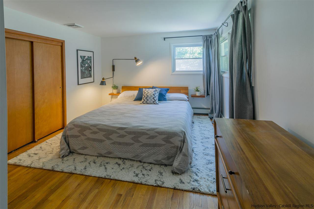 40 Meyers Road Kingston, NY 12401 - Photo 15 of 26 a bedroom with a bed and wooden floor