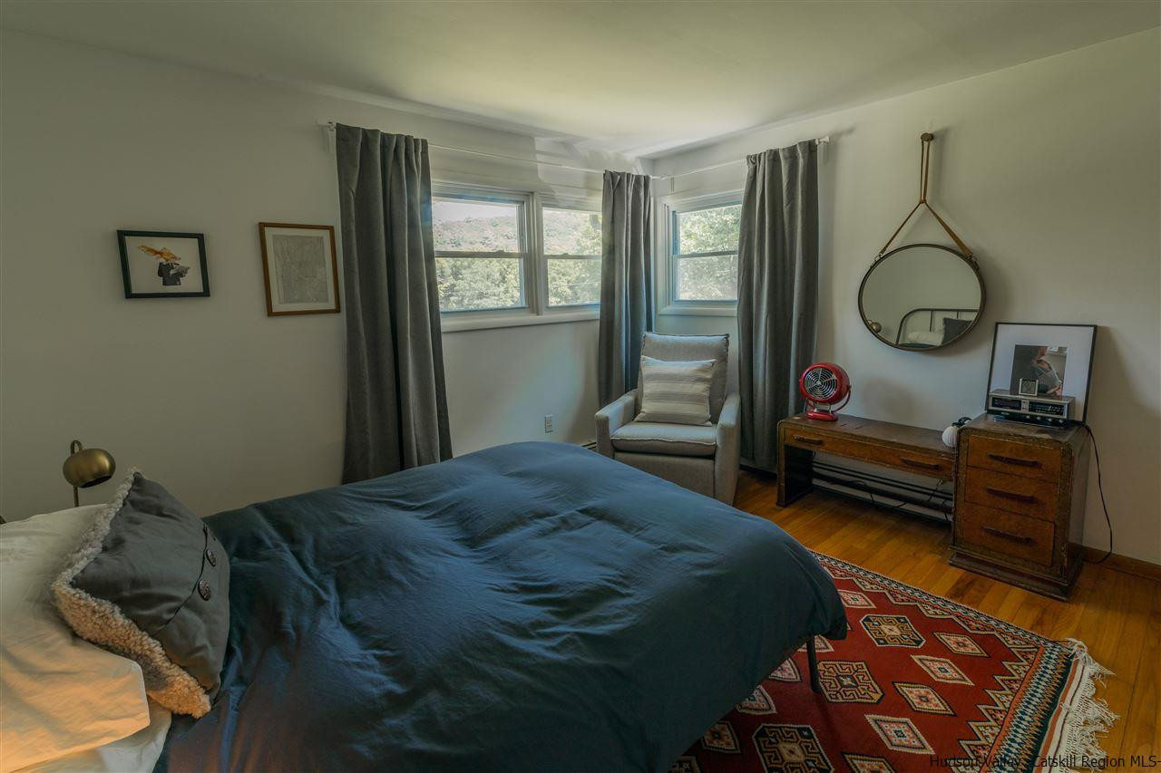 40 Meyers Road Kingston, NY 12401 - Photo 18 of 26 a bedroom with a bed a mirror and a window