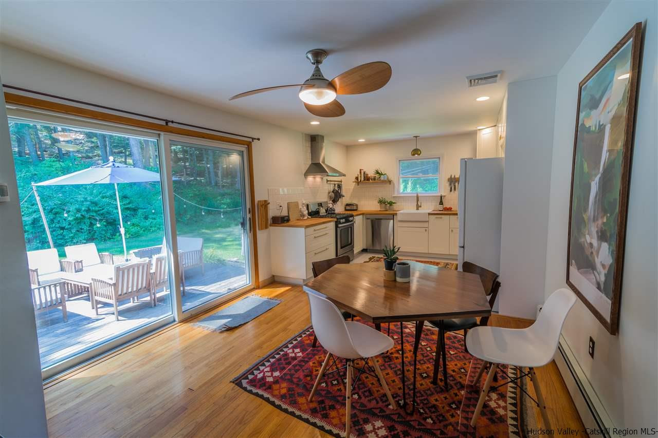 40 Meyers Road Kingston, NY 12401 - Photo 8 of 26 a dining room with furniture a chandelier and wooden floor