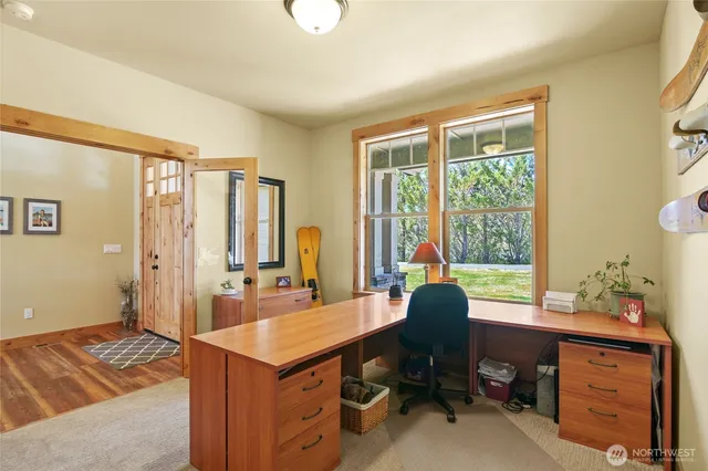 a workspace with furniture and a window