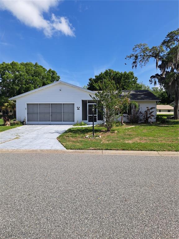 a view of a house with a yard