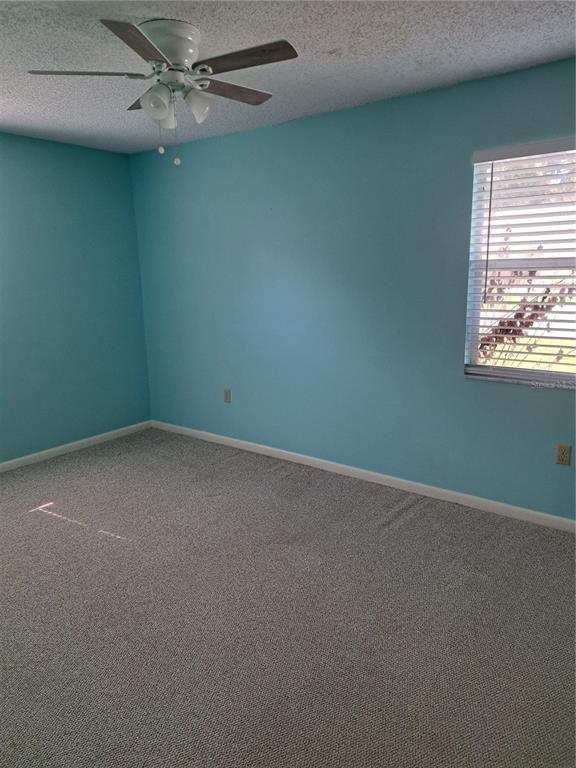 5618 Rosewall Circle Leesburg, FL 34748 - Photo 12 of 29 an empty room with a window