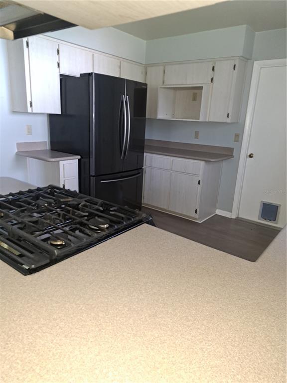 5618 Rosewall Circle Leesburg, FL 34748 - Photo 6 of 29 a kitchen with a refrigerator and a stove