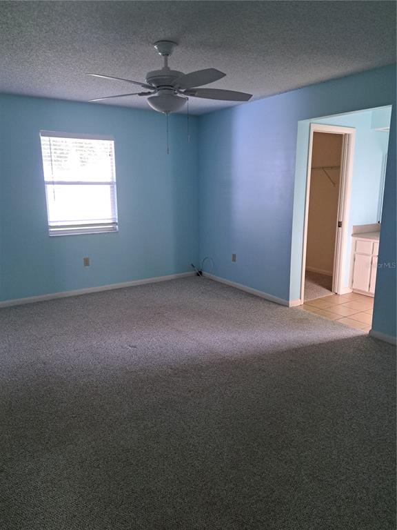 5618 Rosewall Circle Leesburg, FL 34748 - Photo 8 of 29 a view of empty room with windows