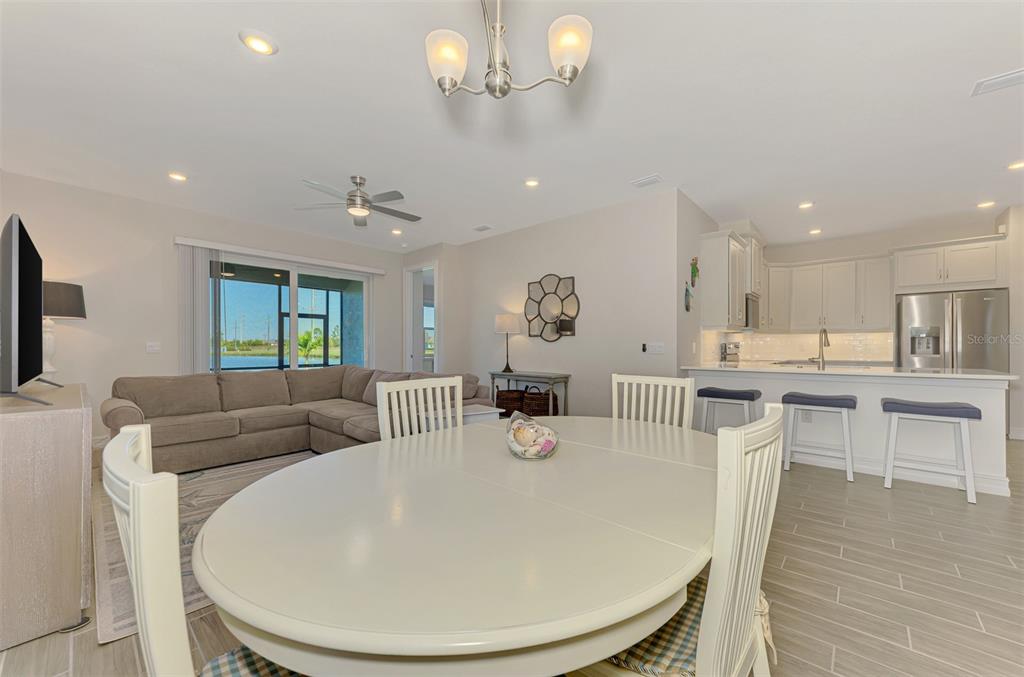 387 Ibiza Loop Venice, FL 34292 - Photo 11 of 60 a living room with furniture and a wooden floor