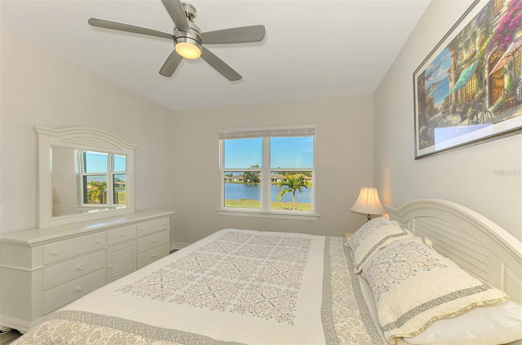 387 Ibiza Loop Venice, FL 34292 - Photo 22 of 60 a bedroom with a bed and a window