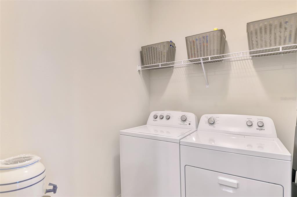 387 Ibiza Loop Venice, FL 34292 - Photo 32 of 60 a utility room with dryer and washer