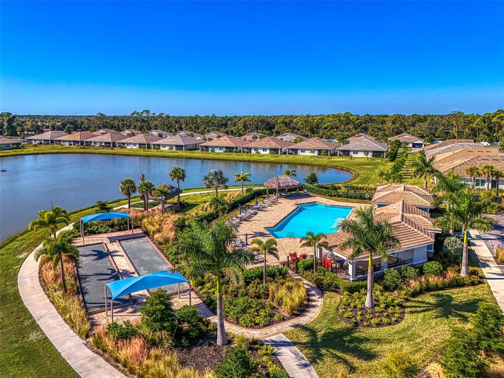 387 Ibiza Loop Venice, FL 34292 - Photo 42 of 60 an aerial view of a houses with a swimming pool