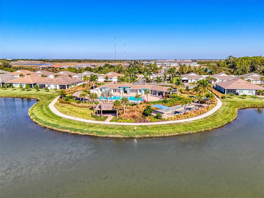 387 Ibiza Loop Venice, FL 34292 - Photo 48 of 60 a view of a swimming pool with a lake