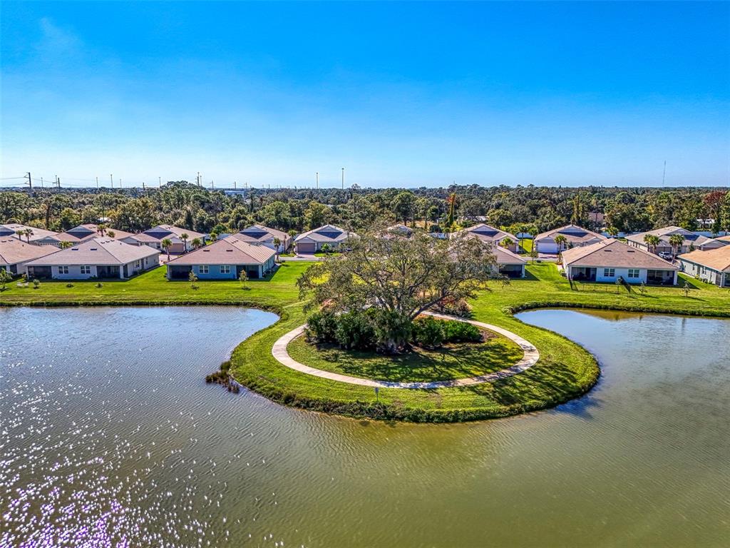 387 Ibiza Loop Venice, FL 34292 - Photo 50 of 60 a view of a lake with a city view