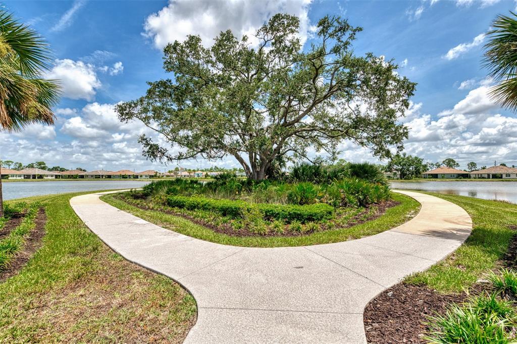 387 Ibiza Loop Venice, FL 34292 - Photo 51 of 60 a view of a swimming pool with a yard